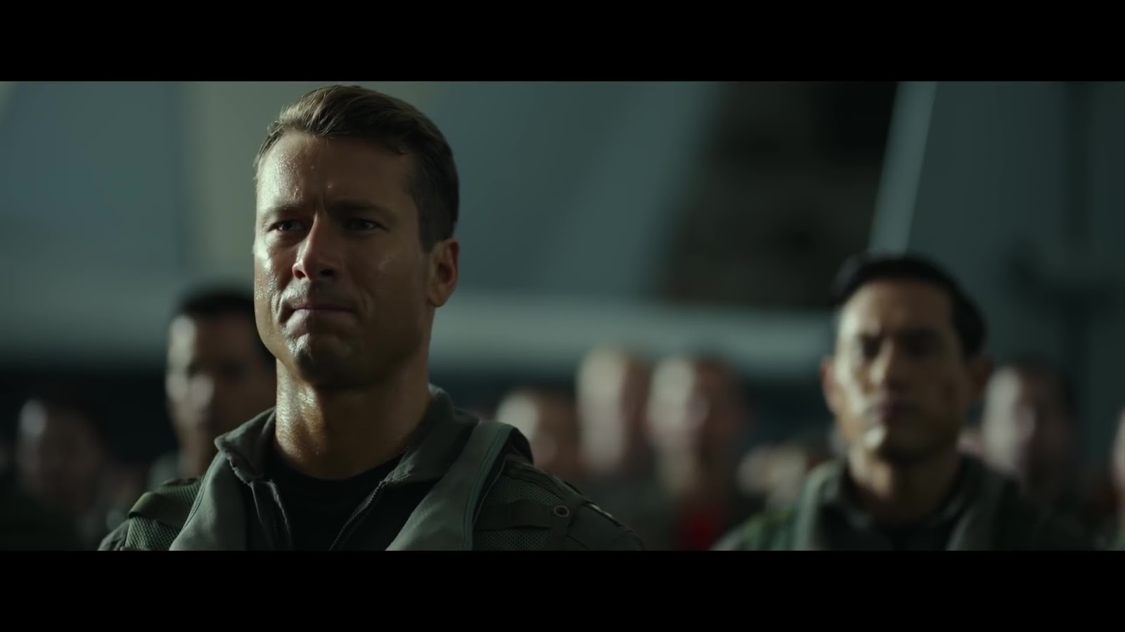 ausCAPS Miles Teller shirtless in Top Gun Maverick trailer