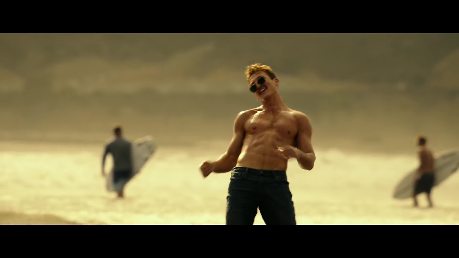 ausCAPS Miles Teller shirtless in Top Gun Maverick trailer